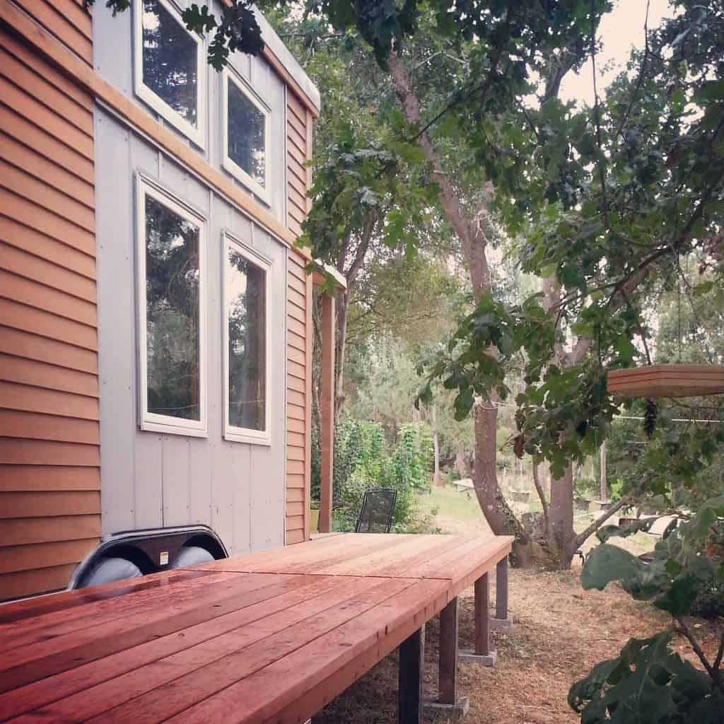 Tiny houses are better with folding redwood decks 